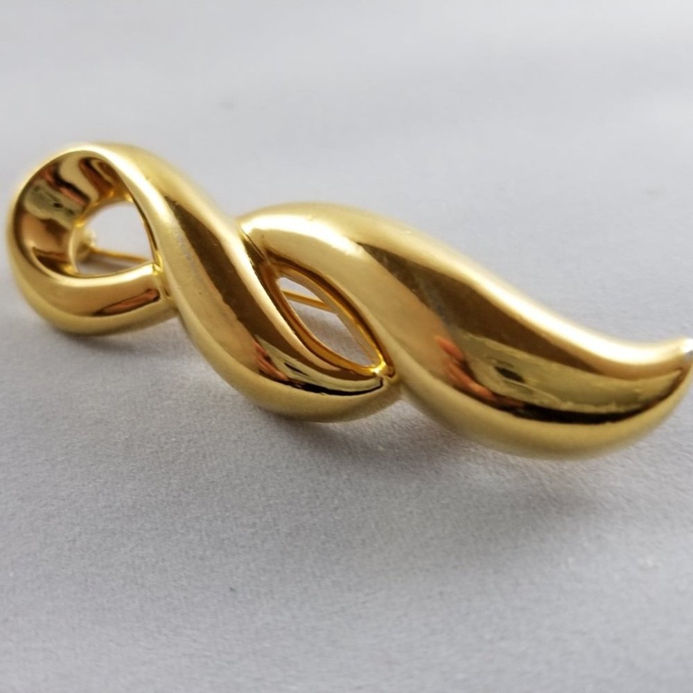 Vintage MONET double swirl gold tone brooch pin